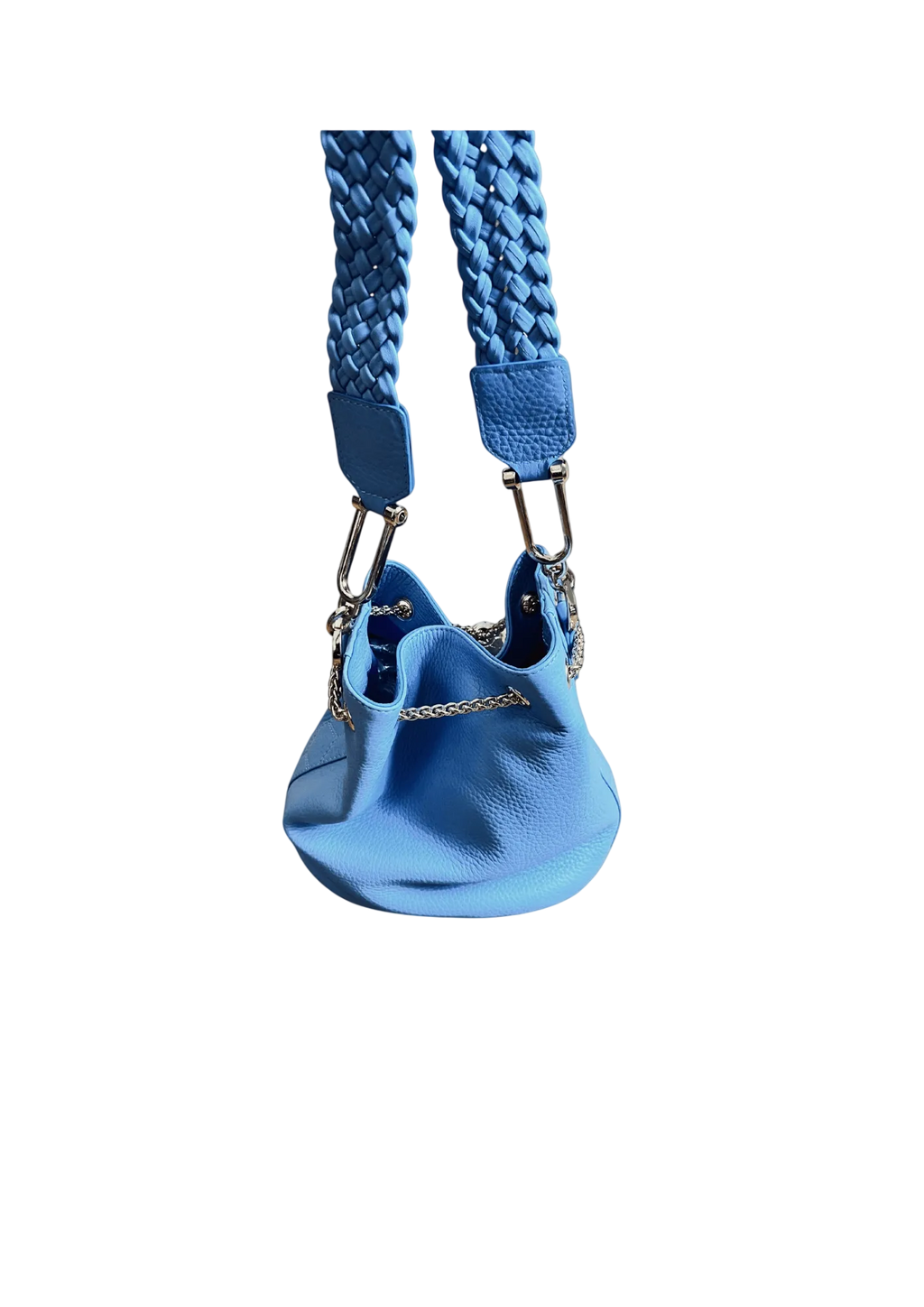 Blue dog harness with textured strap on a beige background