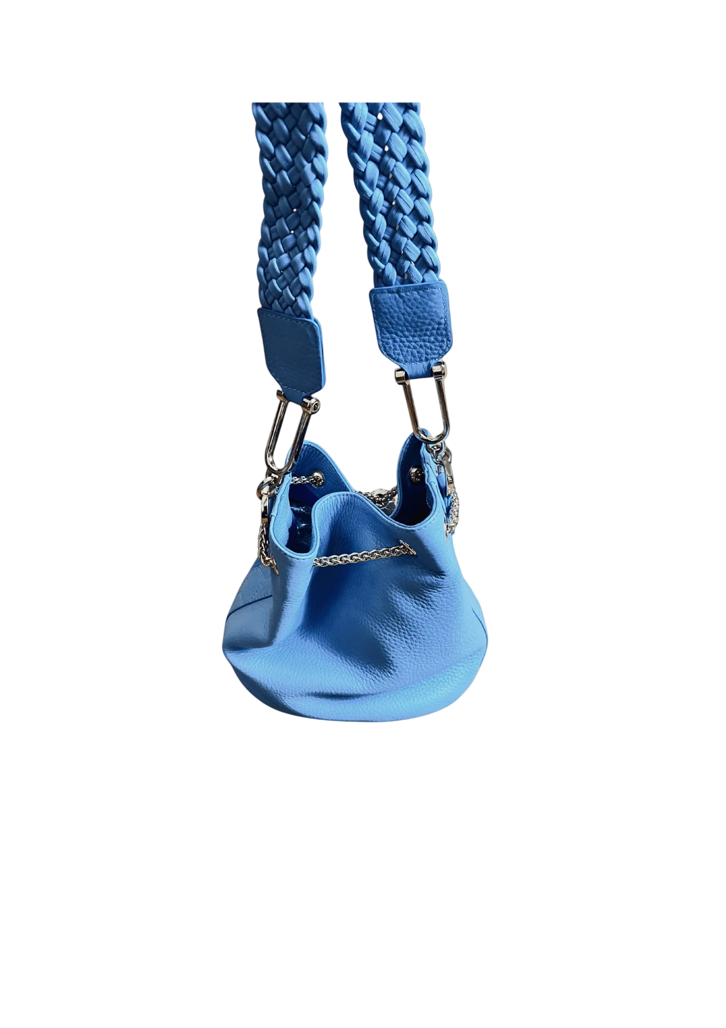 Blue dog harness with textured strap on a beige background