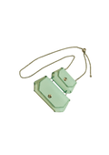 Mint green crossbody bag with gold accents on a beige background
