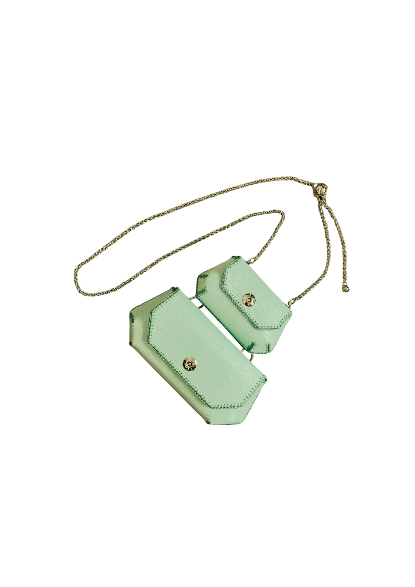 Mint green crossbody bag with gold accents on a beige background