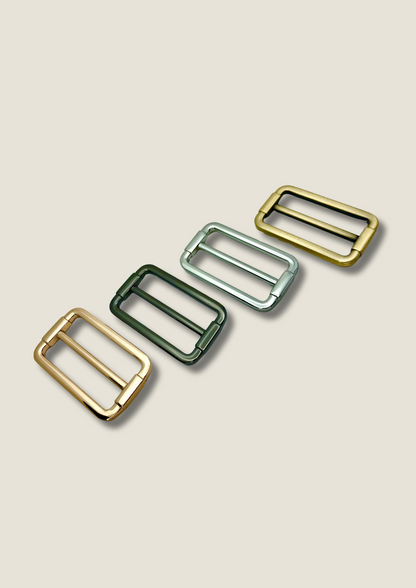 Tri-glide strap buckle