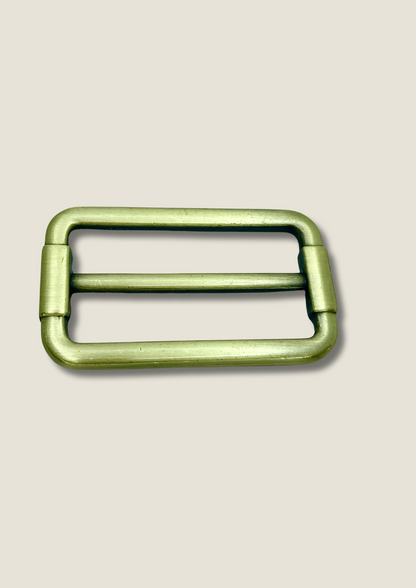 Tri-glide strap buckle